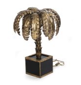 A GILT METAL AND BLACK GLASS PALM SHAPED TABLE LAMP