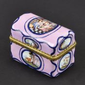 A MINIATURE WRITING SET IN AN ENAMEL BOX