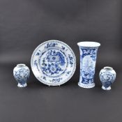 THREE DELFT BLUE AND WHITE PATTERN FAIENCE VASES AND A ROUND DISH