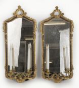 A pair of Italian, stained and parcel gilt carved wood wall mirror appliques