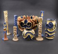 A GROUP OF NINE PAPER MACHEE AND CERAMIC ITEMS