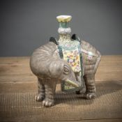 A 'FAMILLE ROSE' PORCELAIN ELEPHANT CANDLESTICK
