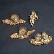 THREE PUTTO HEADS AND A MUSIC MAKING PUTTO