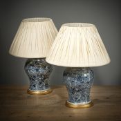 A PAIR OF BLUE AND WHITE PHOENIX PORCELAIN VASES MOUNTED AS LAMPS