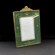 A GILTBRASS AND GREEN FABRIC LINED PHOTO FRAME