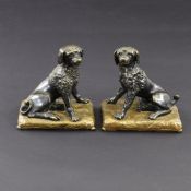A PAIR OF DOG SHAPED BOOK ENDS