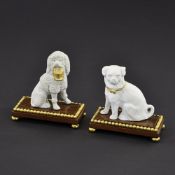 A PAIR OF PORCELAIN DOGS