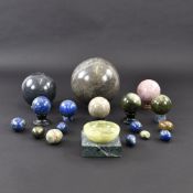 A MIXED LOT OF SPHERICAL BALLS, DECORATIVE EGGS AND A BOWL