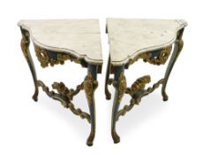 A pair of South German polychrome decorated and parcel gilt corner consoles