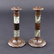 A PAIR OF DECORATIVE MARBLE CANDLESTICKS