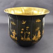 A LARGE METAL WOOD STORAGE OR FLOWER POT