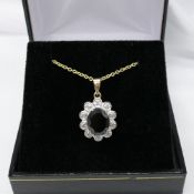 Black sapphire and diamond scalloped pendant and chain in yellow gold; with gift box