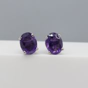 Pair of natural amethyst gemstone ear studs in ste
