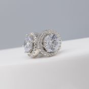 Pair of sterling silver halo stud earrings