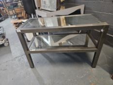 Metal bench with glass top and shelves