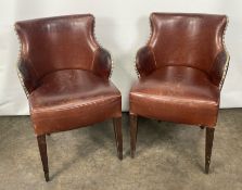 A Pair of Brown Leather Chairs