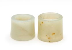 □ TWO CHINESE JADE ARCHERS RINGS, QING DYNASTY