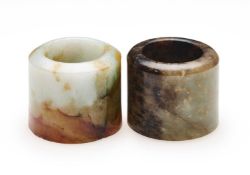 □ TWO CHINESE JADE ARCHERS RINGS, QING DYNASTY, 19TH CENTURY