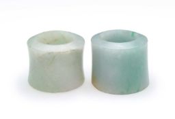 □ TWO CHINESE JADEITE ARCHERS RINGS, QING DYNASTY, 19TH CENTURY