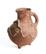 □ AN ANCIENT PERSIAN TERRACOTTA EWER