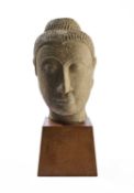 AN AYUTHIA GREY SANDSTONE HEAD OF BUDDHA, THAILAND, CIRCA 16TH CENTURY