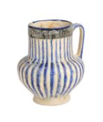 A KASHAN BLUE AND WHITE JUG, PERSIA, 13TH CENTURY