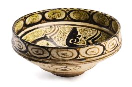 A NISHAPUR SLIP PAINTED POTTERY BOWL, PERSIA, 10TH CENTURY