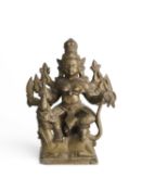 A BRONZE FIGURE OF DURGA SLAYING THE BUFFALO DEMON, DECCAN, 18TH CENTURY