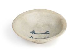 AN ABBASID TIN GLAZED POTTERY BOWL, MESOPOTAMIA, CIRCA 9TH CENTURY
