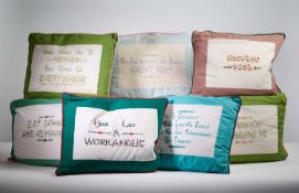 A GROUP OF EMBROIDERED CUSHIONS