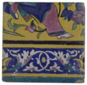 A QAJAR POLYCHROME-GLAZED CUERDA SECA TILE
