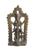 A FOLK BRONZE SHRINE DEPICTING YASHODA CHURNING BUTTER, MAHARASHTRA, 18TH/19TH CENTURY