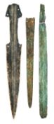 A COPPER ALLOY DAGGER AND TWO BLADES, PROBABLY 1300-800 B.C.
