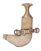 AN ARAB DAGGER (JAMBIYA) WITH SILVER-MOUNTED HILT, EARLY 20TH CENTURY