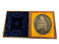 ANTIQUE VICTORIAN DAGUERREOTYPE OF A BABY GIRL PERCHED ON A FOLIATE PATTERN STOOL