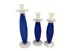 SET OF THREE HAND MADE COBALT BLUE AND FROSTED GLASS PILLAR CANDLESTICKS WITH ECTHED FLORAL PATTERN