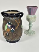 A Austrian Amphora pottery twin handled impress vase of tapered form with enamel parrot,  flowers