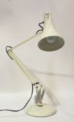 A Vintage anglepoise lamp, with conical shade and on a circular base, stamped 'Anglepoise lighting