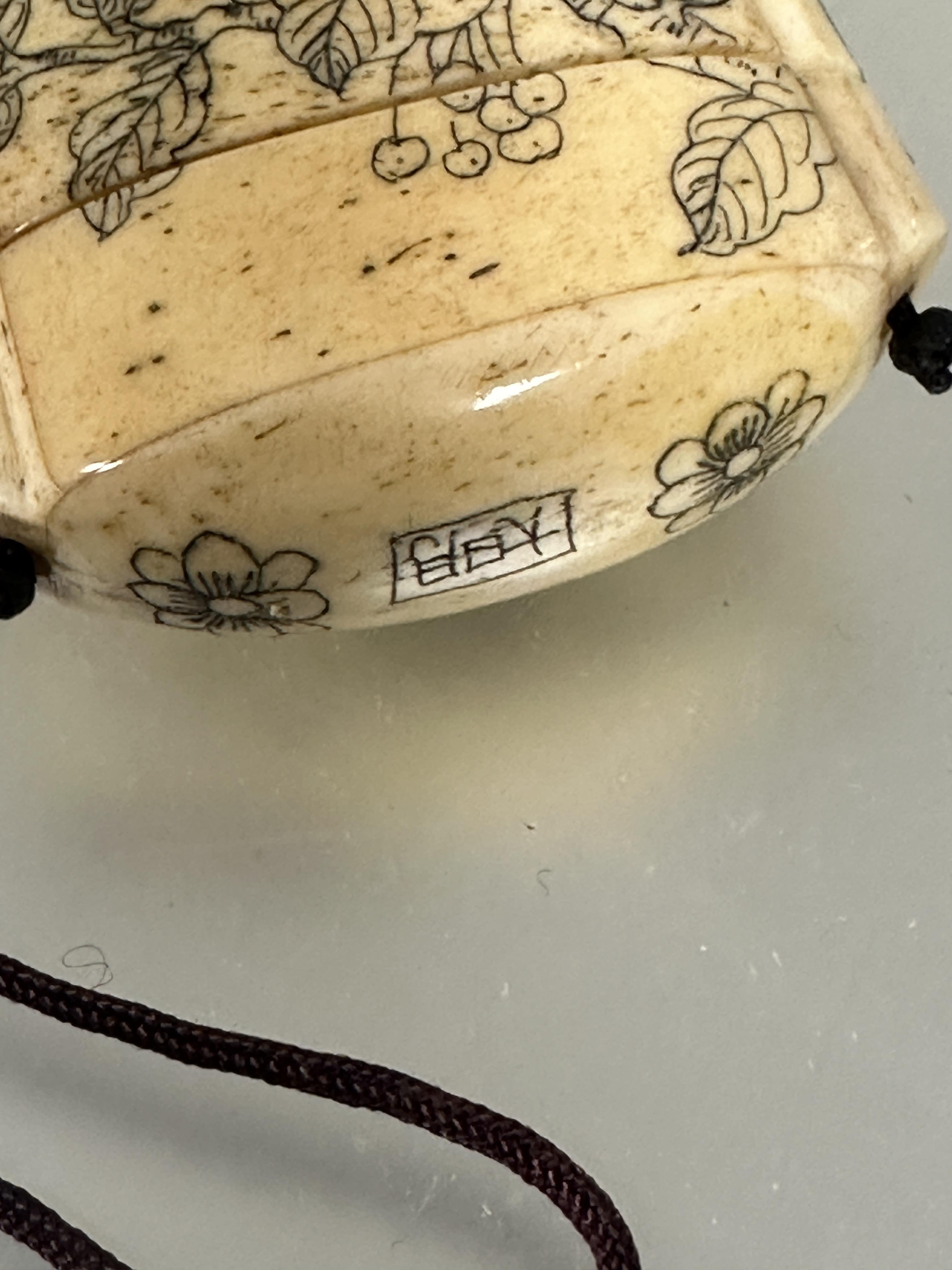 A modern Japanese style carved bone Inro mounted on burgundy cord and bead Ojime and four sections - Image 2 of 4