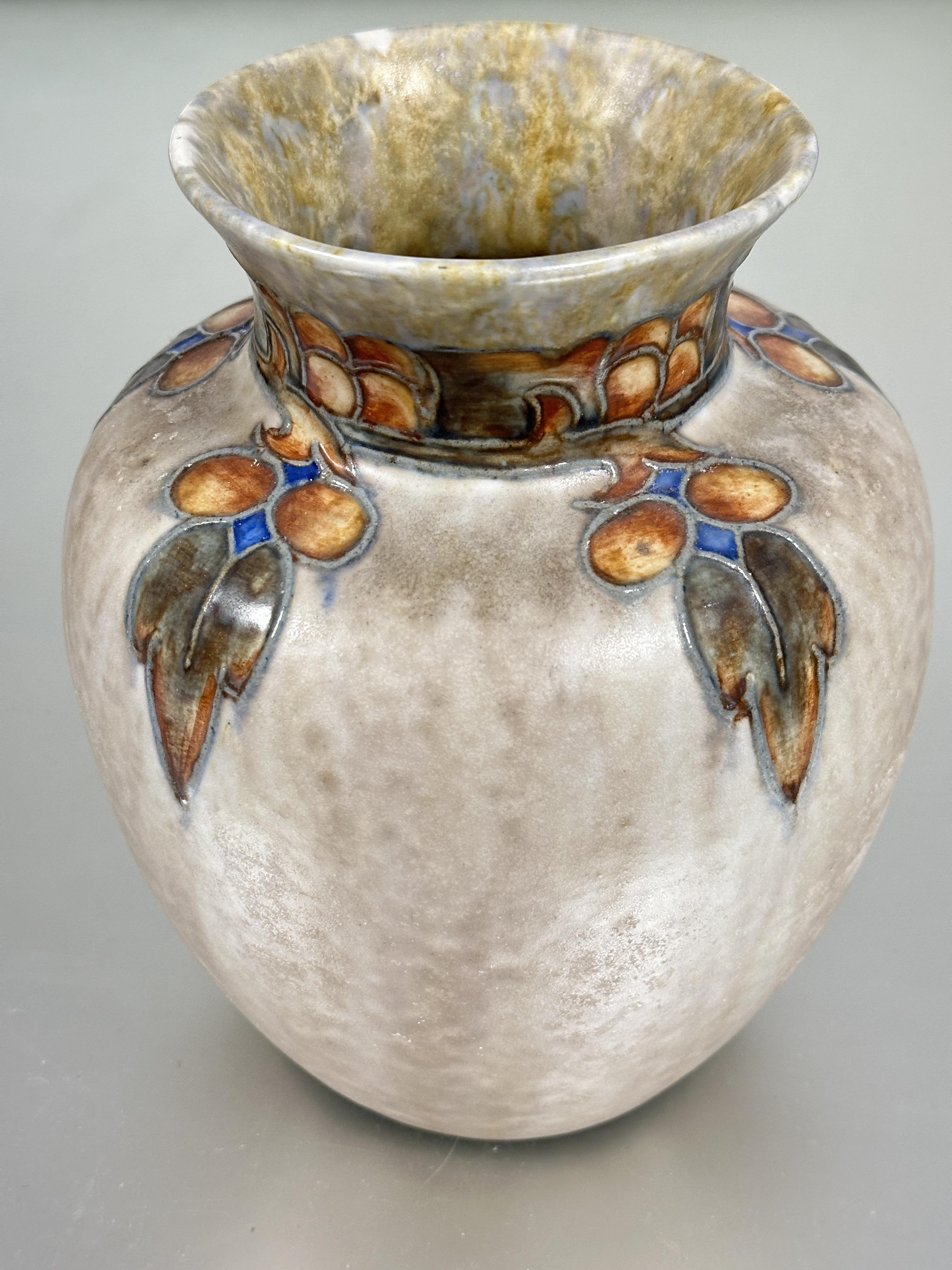 A Cranston Pearl Pottery baluster vase circa 1928 with tube lined berry and leaf design to neck in