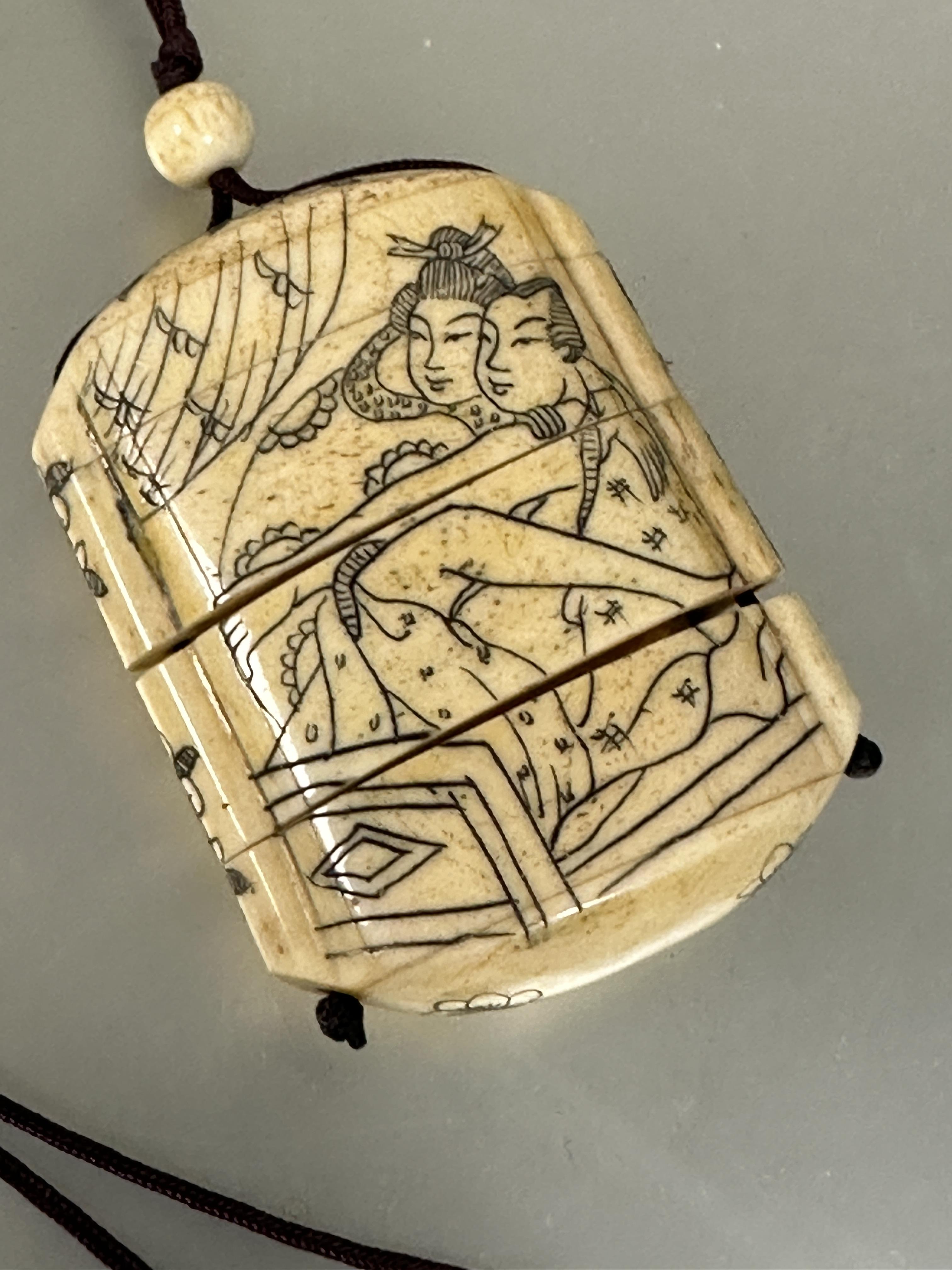 A modern Japanese style carved bone Inro mounted on burgundy cord and bead Ojime and four sections - Image 4 of 4