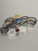 A collection of costume jewellery including an amethyst glass Lalique style Art Deco belt buckle L x