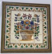 A 20thc Portuguese decorative tile panel depicting a study of flowers with decorative boarder,