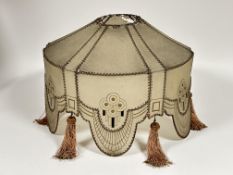 A vintage 1920s waxed plastic standard lamp shade of scalloped stitched paneled design with