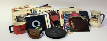 A mixed group comprising a collection of single discs comprising, Modern Talking,WHAM, Elvis Presley