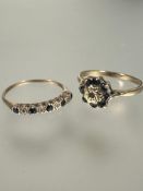 A yellow metal seven stone sapphire cluster ring mounted in claw setting R 2.33g and a 9ct gold four