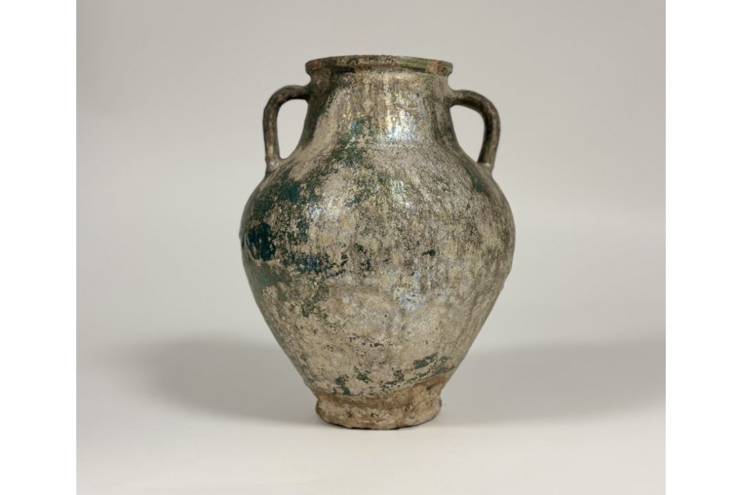 An Islamic, Kashan, glazed pottery twin-handled jar, probably 12th/13th century, with iridescent - Image 3 of 5