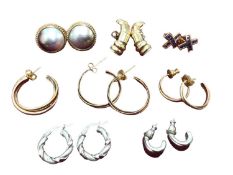 Group of 9ct gold earrings including mother of pearl, pair of sapphire cross earrings, pair of white