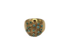 Yellow metal bombé ring set with turquoise stones
