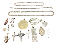 Group of 9ct gold and yellow metal jewellery including three cross pendants, other pendants, charms,